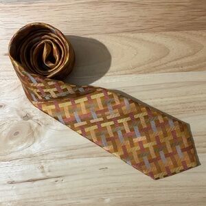 Notdstrom. Cool fall colors tie. “Woven” lines.